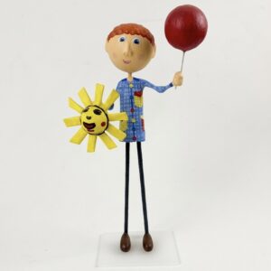 Detall de l'expressió somrient de la figura d'en Rialles, modelada en fusta i pasta.
