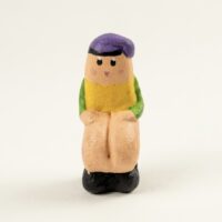 Peça única de caganer per a pessebre, una escultura de col·lecció creada per l'Eva i en Marian.